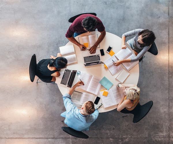 students around desk